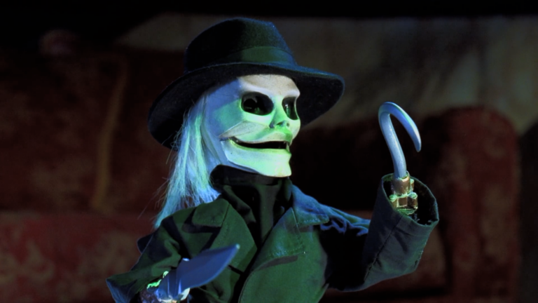 Blade holding his knife and hook in Puppet Master 5, featured in our Puppet Master reboot timeline.