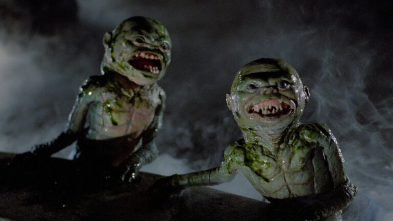 A screenshot from Ghoulies featuring two fish Ghoulies for the Ghoulies reboot timeline article.
